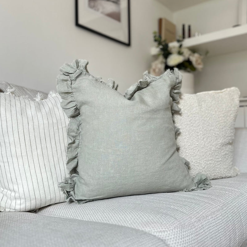 Ruffled edge sage green linen square cushion.