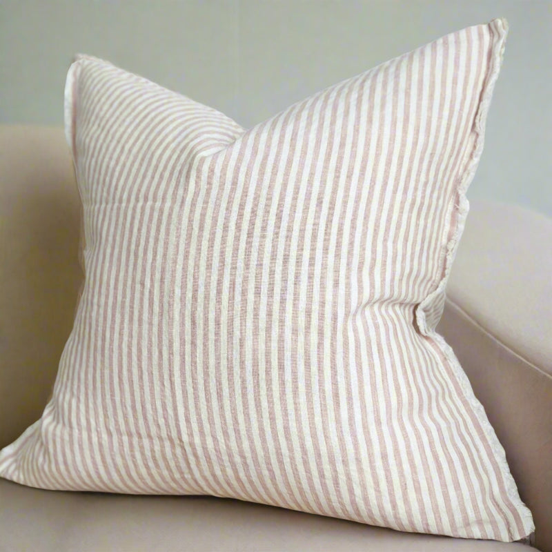 square cream cushion with repeating vertical dusky pink stripes 