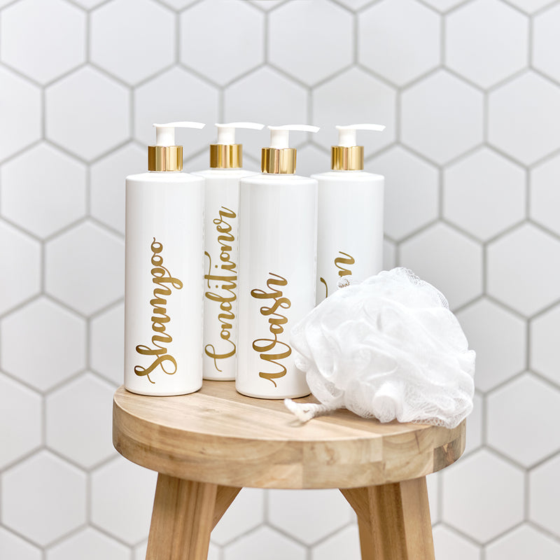 Four 500ml white and gold reusable dispenser pump bottles with custom personalised gold wording, for Shampoo, Conditioner, Wash and Lotion