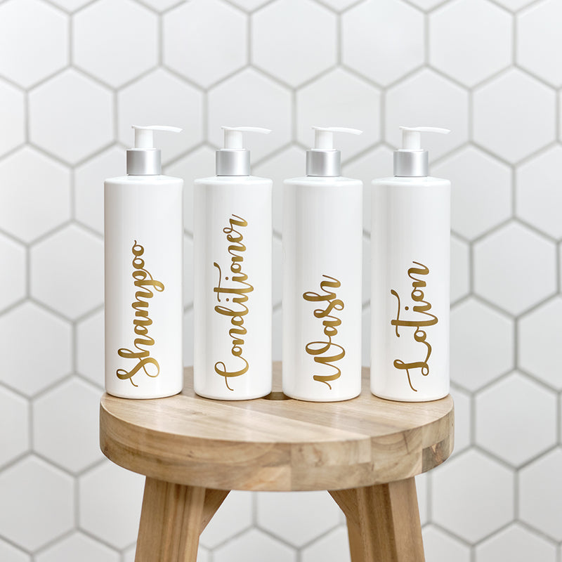 Four 500ml white and silver reusable dispenser pump bottles with custom personalised gold wording, for Shampoo, Conditioner, Wash and Lotion