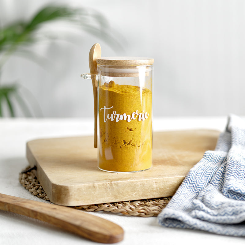 Glass spice jars with an eco friendly bamboo lid and serving spoon, with custom personalised wording for herbs and spices.