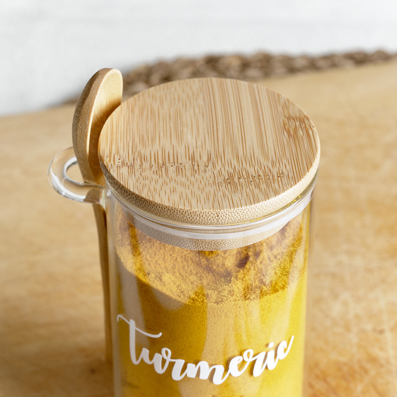 Glass spice jars with an eco friendly bamboo lid and serving spoon, with custom personalised wording for herbs and spices.