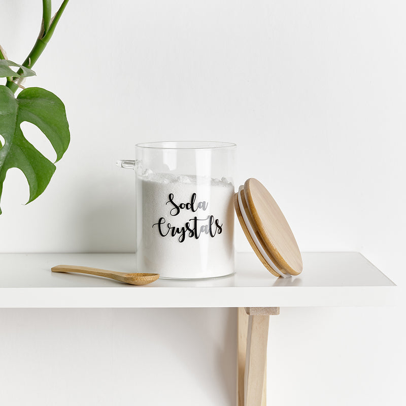 Labelled glass jar with an airtight bamboo lid and serving spoon, with custom personalised wording.